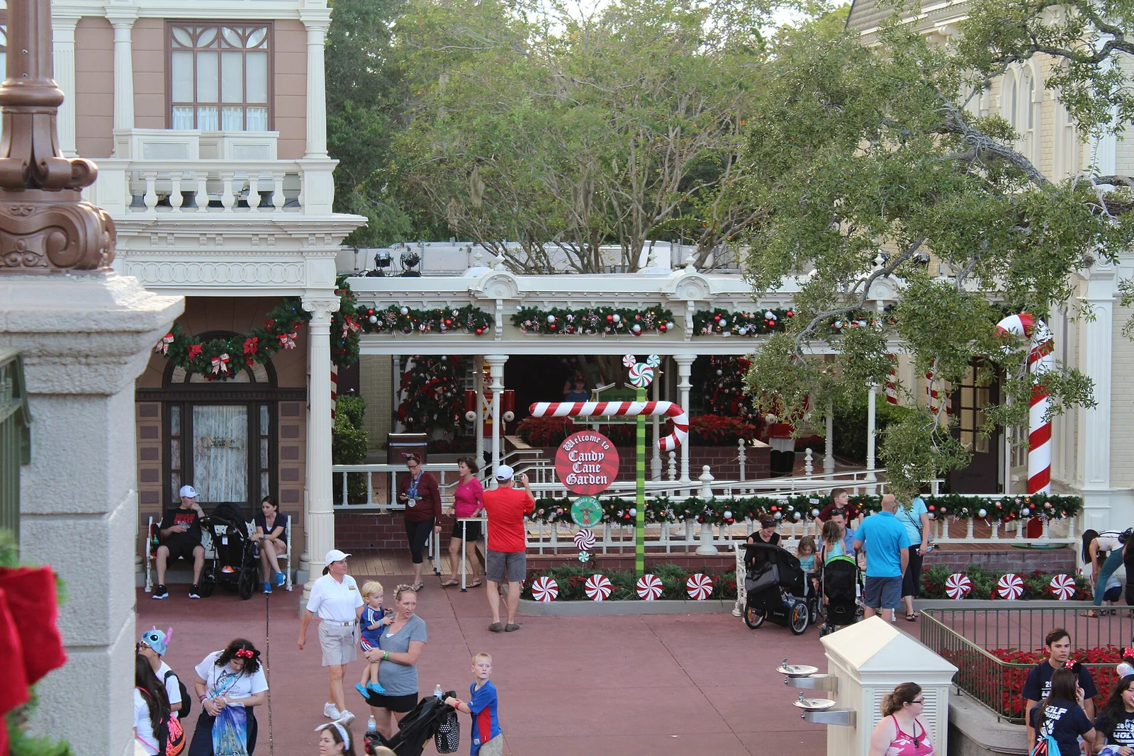 Christmas garlands on a Main Street, U.S.A. building at Magic Kingdom in Florida. Archival photograph from 2016; the past display is shown.